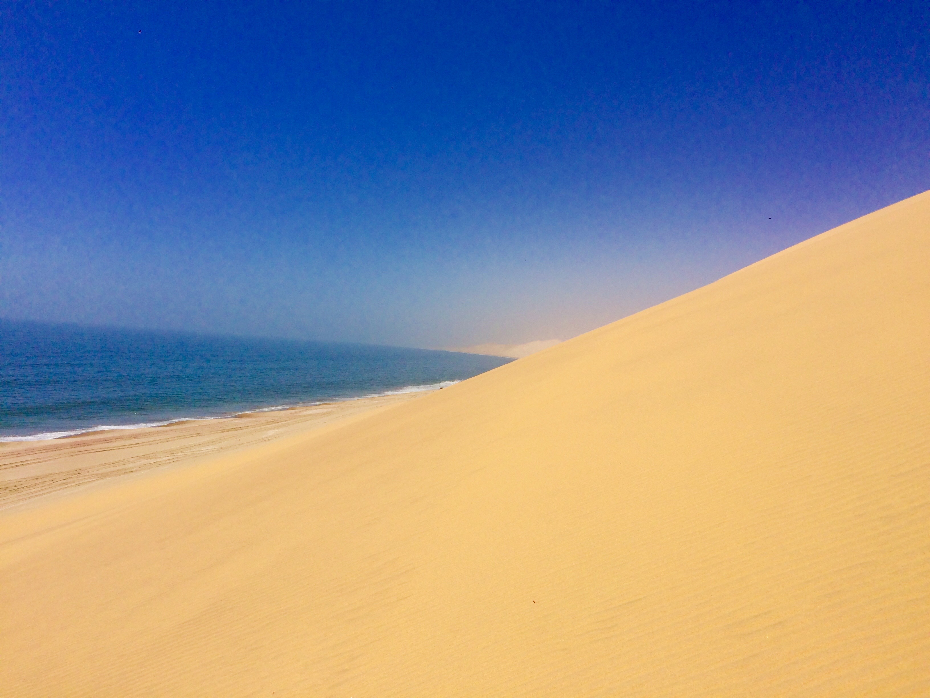SAND DUNES MEET THE SEA, NAMIBIA