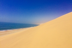 SAND DUNES MEET THE SEA, NAMIBIA